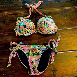Victoria’s Secret swim with a top 34C and bottom size small.